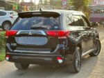 Mitsubishi Outlander PHEV, plug-in hybrid SUV Kenya, import Mitsubishi Outlander PHEV Japan, 2.4L MIVEC hybrid engine, twin electric motor SUV, Super All-Wheel Control S-AWC, electric-only range SUV, fuel-efficient hybrid Kenya, CHAdeMO fast charging, regenerative braking paddles, spacious 5-seater family SUV, panoramic sunroof crossover, leather interior package, advanced safety features, adaptive cruise control, 360-degree camera system, power tailgate SUV, best hybrid SUV Nairobi, second-hand cars Mombasa port, buy Mitsubishi Outlander online Kenya, car import agency Mombasa Road, Japanese auction grade cars, Nairobi car yards, Mombasa Road motor dealers, Ngong Road car showroom, Kiambu Road auto outlets, Thika Road car sales, Nakuru car importers, Eldoret vehicle sales, Kisumu car dealers, Mombasa car imports, Nyeri motor vehicles, Meru car buyers, Malindi vehicle imports, Diani coastal cars, financing for cars Kenya, bank asset finance vehicles, comprehensive car insurance Kenya, spare parts Kirinyaga Road, genuine Mitsubishi parts Nairobi, trusted car dealers Kenya, GN0W chassis Outlander PHEV, GG3W model upgrade Kenya, 13.8 kWh lithium-ion battery, home charging 3-pin plug Kenya, Type 1 to Type 2 adapter cable, public EV charging stations Nairobi, KRA import duty hybrid cars, NTSA motor vehicle registration, asset financing bank loans, comprehensive motor cover Kenya, direct import from Japan, low mileage plug-in hybrid, Black Edition Outlander PHEV, G-Package trim, P-Package luxury trim, S-Edition Bilstein shocks, 190mm ground clearance Kenya, rough road suspension tuning, urban family crossover Kenya, silent electric drive mode, daily commute fuel savings, zero emission city driving, dual-zone climate control, Apple CarPlay Android Auto, smartphone link display audio, heated front seats, power adjustable driver seat, LED headlights and fog lamps, alloy wheels upgrade, roof rails utility, rear spoiler design, multi-information display cluster, electronic parking brake, hill descent control, active stability control ASC, blind spot warning, rear cross traffic alert, forward collision mitigation, lane departure warning, ISOFIX child seat anchors, smart keyless entry, push-to-start ignition, power folding side mirrors, rain-sensing wipers, automatic high beam, premium Rockford Fosgate sound system, USB charging ports rear, 12V auxiliary battery maintenance, hybrid system diagnostic scan, specialized EV mechanics Nairobi, coolant flush service, brake pad replacement, Michelin and Bridgestone tyres, Chloride Exide battery dealers, roadside assistance Kenya, AA rescue coverage, port clearance logistics, container freight station delivery, bond warehouse release, logbook transfer process, TIMS account verification, annual motor inspection, resale value hybrid cars, eco-friendly driving Kenya, road trip ready SUV, upcountry driving comfort, weekend getaway vehicle, spacious boot capacity, fold-flat rear seats, durable roof racks, premium floor mats, door visors, mud flaps, body protection film, ceramic coating detailing, professional car wash Nairobi, engine bay steam cleaning, interior vacuuming, leather seat conditioning, steering wheel wrap, window tinting legal limits, dash camera installation, vehicle tracking security, anti-theft immobilizer, comprehensive extended warranty, trade-in options Nairobi, certified pre-owned inspection, motor mart alternatives, bazaar car sales events, online auto listing platform, top-rated family car Kenya, executive commuter crossover