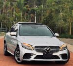 Mercedes Benz C200, Mercedes C200 Kenya, Luxury Sedan Nairobi, Used Mercedes C200 Price, Import Mercedes Benz Kenya, German Cars Nairobi, Executive Sedan Kenya, Mercedes C200 AMG Line, Mercedes C200 BlueEFFICIENCY, BMW 3 Series Alternative, Audi A4 Competitor, Best Luxury Cars Kenya, Mombasa Road Car Dealers, Jamhuri Motors Nairobi, Left Hand Drive Mercedes, Right Hand Drive C200, Auto Selection Kenya, Car Import Agents Nairobi, KRA Vehicle Import Duty, Japanese Import Mercedes C200, UK Import Mercedes Kenya, Certified Pre-Owned Cars Nairobi, Affordable Luxury Sedans, Fuel Efficient Luxury Cars, Hybrid Mercedes C200, 9G-Tronic Transmission, MBUX Infotainment System, Artico Leather Interior, Ambient Lighting Sedan, Panoramic Sunroof Mercedes, Keyless Go Mercedes C200, LED Intelligent Light System, Parking Package 360 Camera, Collision Prevention Assist, Attention Assist Mercedes, Sport Suspension Sedan, Alloy Wheels Mercedes C200, Rear-Wheel Drive Sedan, 4MATIC Mercedes Kenya, Turbocharged Luxury Car, 1.5L Hybrid C200, 2.0L Turbo Sedan, Car Financing Kenya, Asset Finance Mercedes Benz, Bank Financing Car Kenya, Comprehensive Car Insurance Kenya, Logbook Transfer Nairobi, NTSA Vehicle Registration, Car Spare Parts Nairobi, Mercedes Specialist Mechanics Kenya, German Auto Garage Nairobi, Car Maintenance Kenya, Second Hand Cars Jiji Kenya, Pigiame Cars Mercedes, Autochek Kenya C200, Cheki Kenya Mercedes Benz, Car Dealerships Westlands, Lavington Car Sale, Karen Luxury Cars, Kilimani Auto Dealers, Mombasa Car Imports, Kisumu Used Cars, Nakuru Car Dealerships, Eldoret Vehicle Sales, Thika Road Car Yards, Industrial Area Mechanics Nairobi, Car Detailing Nairobi, Ceramic Coating Cars Kenya, Window Tinting Legal Kenya, Executive Car Rental Nairobi, Wedding Cars Mercedes Kenya, VIP Transport Nairobi, Corporate Fleet Vehicles, Executive Chauffeur Services, Trade-In Cars Kenya, Upgrade Your Car Nairobi, Car Inspection Services AA Kenya, Pre-Purchase Car Inspection, Best Family Sedans Kenya, Daily Driver Luxury Car, Reliable German Cars, High Resale Value Cars Kenya, Classic Mercedes C200, Modern Luxury Sedan, Smart Driving Assist, Adaptive Cruise Control Car, Lane Keeping Assist Sedan, Blind Spot Monitor Car, Heated Front Seats Mercedes, Memory Seats Driver Package, Dual-Zone Climate Control, Burmester Sound System Option, Apple CarPlay Android Auto Car, Wireless Phone Charging Sedan, Automatic Tailgate Mercedes, Rain Sensing Wipers, Tyre Pressure Monitoring, Electronic Stability Control, Anti-Lock Braking System, Isofix Child Seat Mounts, Curtain Airbags Sedan, Side Impact Protection, Crash Test Safety Rating, Fuel Economy Luxury Sedan, Eco Start Stop Function, Comfort Suspension Setup, Sport Plus Driving Mode, Paddle Shifters Mercedes, Multi-Function Steering Wheel, Digital Cockpit Display, Touchscreen Infotainment Car, Bluetooth Handsfree Sedan, USB-C Ports Car, Ambient Air Package, Cabin Air Filtration, Premium Floor Mats Mercedes, Door Sill Illumination, Chrome Exterior Trim, Privacy Glass Windows, Run-Flat Tyres Kenya, Spare Wheel Kit, First Aid Kit Mercedes, Warning Triangle Car, Owner's Manual Digital, Service History Logbook, Genuine Mercedes Parts, Performance Tuning Kenya, ECU Remap Mercedes C200, Exhaust Upgrade Sedan, Body Kit Installation, Custom Alloy Rims, Brake Pad Replacement Kenya, Rotor Resurfacing Nairobi, Transmission Fluid Change, Coolant Flush Service, Spark Plug Replacement, Air Filter Change, Oil Filter Genuine, Synthetic Engine Oil Kenya, Professional Car Wash Nairobi, Interior Vacuum Detailing, Leather Conditioning Treatment, Paint Protection Film, Rust Proofing Cars Kenya, Windshield Repair Nairobi, Dent Removal Services, Insurance Claim Garage, Roadside Assistance Kenya, Towing Services Nairobi, 24/7 Car Recovery, Happy Motoring Kenya