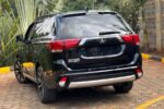 Mitsubishi Outlander PHEV, plug-in hybrid SUV Kenya, import Mitsubishi Outlander PHEV Japan, 2.4L MIVEC hybrid engine, twin electric motor SUV, Super All-Wheel Control S-AWC, electric-only range SUV, fuel-efficient hybrid Kenya, CHAdeMO fast charging, regenerative braking paddles, spacious 5-seater family SUV, panoramic sunroof crossover, leather interior package, advanced safety features, adaptive cruise control, 360-degree camera system, power tailgate SUV, best hybrid SUV Nairobi, second-hand cars Mombasa port, buy Mitsubishi Outlander online Kenya, car import agency Mombasa Road, Japanese auction grade cars, Nairobi car yards, Mombasa Road motor dealers, Ngong Road car showroom, Kiambu Road auto outlets, Thika Road car sales, Nakuru car importers, Eldoret vehicle sales, Kisumu car dealers, Mombasa car imports, Nyeri motor vehicles, Meru car buyers, Malindi vehicle imports, Diani coastal cars, financing for cars Kenya, bank asset finance vehicles, comprehensive car insurance Kenya, spare parts Kirinyaga Road, genuine Mitsubishi parts Nairobi, trusted car dealers Kenya, GN0W chassis Outlander PHEV, GG3W model upgrade Kenya, 13.8 kWh lithium-ion battery, home charging 3-pin plug Kenya, Type 1 to Type 2 adapter cable, public EV charging stations Nairobi, KRA import duty hybrid cars, NTSA motor vehicle registration, asset financing bank loans, comprehensive motor cover Kenya, direct import from Japan, low mileage plug-in hybrid, Black Edition Outlander PHEV, G-Package trim, P-Package luxury trim, S-Edition Bilstein shocks, 190mm ground clearance Kenya, rough road suspension tuning, urban family crossover Kenya, silent electric drive mode, daily commute fuel savings, zero emission city driving, dual-zone climate control, Apple CarPlay Android Auto, smartphone link display audio, heated front seats, power adjustable driver seat, LED headlights and fog lamps, alloy wheels upgrade, roof rails utility, rear spoiler design, multi-information display cluster, electronic parking brake, hill descent control, active stability control ASC, blind spot warning, rear cross traffic alert, forward collision mitigation, lane departure warning, ISOFIX child seat anchors, smart keyless entry, push-to-start ignition, power folding side mirrors, rain-sensing wipers, automatic high beam, premium Rockford Fosgate sound system, USB charging ports rear, 12V auxiliary battery maintenance, hybrid system diagnostic scan, specialized EV mechanics Nairobi, coolant flush service, brake pad replacement, Michelin and Bridgestone tyres, Chloride Exide battery dealers, roadside assistance Kenya, AA rescue coverage, port clearance logistics, container freight station delivery, bond warehouse release, logbook transfer process, TIMS account verification, annual motor inspection, resale value hybrid cars, eco-friendly driving Kenya, road trip ready SUV, upcountry driving comfort, weekend getaway vehicle, spacious boot capacity, fold-flat rear seats, durable roof racks, premium floor mats, door visors, mud flaps, body protection film, ceramic coating detailing, professional car wash Nairobi, engine bay steam cleaning, interior vacuuming, leather seat conditioning, steering wheel wrap, window tinting legal limits, dash camera installation, vehicle tracking security, anti-theft immobilizer, comprehensive extended warranty, trade-in options Nairobi, certified pre-owned inspection, motor mart alternatives, bazaar car sales events, online auto listing platform, top-rated family car Kenya, executive commuter crossover